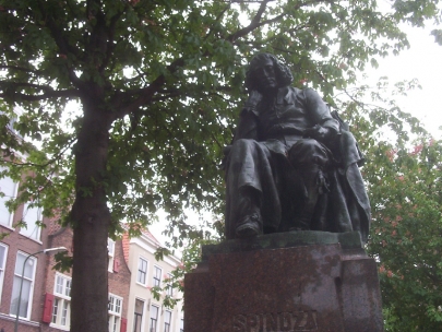 sad Spinoza statue in sad neighborhood
