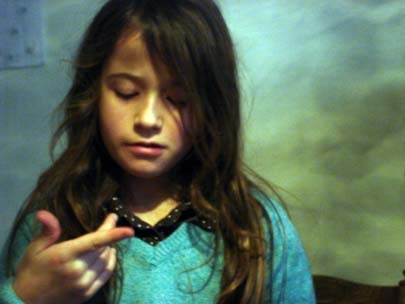 on the tip of her finger