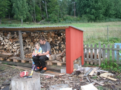 Reading bedtime story in woodshed
